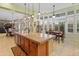 Open concept kitchen with an island, breakfast nook, and views into the dining area at 12519 W Bajada Rd, Peoria, AZ 85383