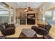 Bright living room featuring a fireplace and ample natural light at 12519 W Bajada Rd, Peoria, AZ 85383