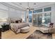 Relaxing main bedroom with a plush bed and sitting area at 12519 W Bajada Rd, Peoria, AZ 85383