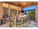 Covered patio with a built-in outdoor kitchen and fireplace at 12519 W Bajada Rd, Peoria, AZ 85383