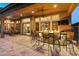 Covered patio features an outdoor kitchen with a fire pit and bar seating at 12519 W Bajada Rd, Peoria, AZ 85383