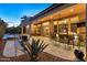 Relaxing outdoor space with a built-in fire pit, bar seating, and access to the pool at 12519 W Bajada Rd, Peoria, AZ 85383