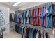 Spacious walk-in closet with ample hanging space and shelving at 12519 W Bajada Rd, Peoria, AZ 85383