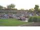 Community water feature with cascading waterfalls and landscaping at 12519 W Bajada Rd, Peoria, AZ 85383