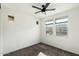 Cozy bedroom with gray carpeting, ceiling fan, and multiple windows at 1288 E Derringer Way, Chandler, AZ 85286