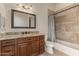 Bathroom with granite countertop, tiled shower, and updated vanity at 14047 E Lowden Ct, Scottsdale, AZ 85262