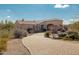 One-story home with a brick driveway and desert landscaping at 14047 E Lowden Ct, Scottsdale, AZ 85262