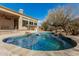 Lush landscaping surrounds this freeform pool and spa at 14047 E Lowden Ct, Scottsdale, AZ 85262