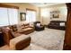 Living room with L-shaped sectional and large area rug at 1414 N Estrada --, Mesa, AZ 85207