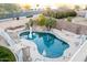Inviting kidney-shaped pool with surrounding patio and landscaping at 1414 N Estrada --, Mesa, AZ 85207