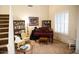 Study with piano, comfortable seating, and built-in shelving at 1414 N Estrada --, Mesa, AZ 85207