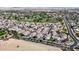 Expansive aerial view showcasing the community, lush golf course, and well-maintained landscaping at 14200 W Village Pkwy # 113, Litchfield Park, AZ 85340