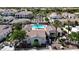 Beautiful aerial view of the pool area within the community, surrounded by lush trees at 14200 W Village Pkwy # 113, Litchfield Park, AZ 85340