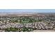 Panoramic aerial view displaying the community, golf course, and surrounding desert landscape at 14200 W Village Pkwy # 113, Litchfield Park, AZ 85340