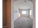 Spacious bedroom featuring neutral walls, carpet flooring, two large windows, and recessed lighting at 14200 W Village Pkwy # 113, Litchfield Park, AZ 85340