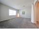Cozy bedroom with plush carpeting, a large window providing natural light, and neutral paint at 14200 W Village Pkwy # 113, Litchfield Park, AZ 85340