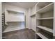 Walk-in closet with built-in shelving and hanging rods at 14200 W Village Pkwy # 113, Litchfield Park, AZ 85340