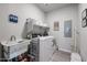 Laundry room with washer, dryer, and utility sink at 14200 W Village Pkwy # 113, Litchfield Park, AZ 85340