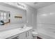 Bathroom with tub and white vanity at 1448 N 80Th Dr, Phoenix, AZ 85043