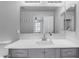 Modern gray vanity with a white countertop at 1448 N 80Th Dr, Phoenix, AZ 85043