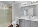 Bathroom with walk-in shower and modern vanity at 1448 N 80Th Dr, Phoenix, AZ 85043