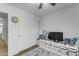 bedroom with TV, storage, and play area at 1448 N 80Th Dr, Phoenix, AZ 85043
