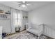 bedroom with crib and window seating at 1448 N 80Th Dr, Phoenix, AZ 85043