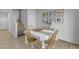 Casual dining area with a white table and four chairs near staircase at 1448 N 80Th Dr, Phoenix, AZ 85043