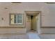 Townhome entry with green door and neutral-colored walls at 1448 N 80Th Dr, Phoenix, AZ 85043
