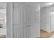 White double-door closet in a hallway at 1448 N 80Th Dr, Phoenix, AZ 85043