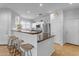Modern kitchen with stainless steel appliances and an island with seating at 1448 N 80Th Dr, Phoenix, AZ 85043