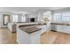 Open kitchen features a breakfast bar and dark countertops at 1448 N 80Th Dr, Phoenix, AZ 85043
