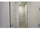 Hallway with doors to laundry and other rooms at 15781 W Hackamore Dr, Surprise, AZ 85387