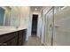 Modern bathroom with double vanity, large shower, and ample storage at 15790 W Hackamore Dr, Surprise, AZ 85387