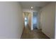 Bright hallway with tile flooring and access to bedrooms and living areas at 15790 W Hackamore Dr, Surprise, AZ 85387