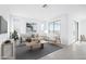 Bright and airy living room with large windows and comfortable seating at 15790 W Hackamore Dr, Surprise, AZ 85387