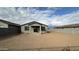 Large backyard with a covered patio and block wall at 15797 W Hackamore Dr, Surprise, AZ 85387