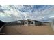 Spacious backyard with a covered patio and block wall at 15797 W Hackamore Dr, Surprise, AZ 85387