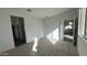 Bright bedroom with carpet flooring and access to a bathroom at 15797 W Hackamore Dr, Surprise, AZ 85387