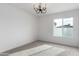 Well-lit bedroom featuring large window and neutral tones at 16032 N 46Th Pl, Phoenix, AZ 85032