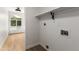 Bright laundry room with built-in shelving and window at 16032 N 46Th Pl, Phoenix, AZ 85032