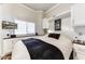 Bright bedroom with built-in cabinets and a comfortable bed at 17200 W Bell Rd # 196, Surprise, AZ 85374