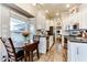 Eat-in kitchen with white cabinets, granite counters and island at 17200 W Bell Rd # 196, Surprise, AZ 85374