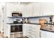 Corner kitchen with stainless steel appliances and granite counters at 17200 W Bell Rd # 196, Surprise, AZ 85374