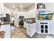 Modern kitchen with white cabinets and granite countertops at 17200 W Bell Rd # 196, Surprise, AZ 85374