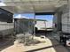 Patio with table, chairs, and storage shed at 17200 W Bell Rd # 196, Surprise, AZ 85374