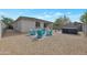 Backyard with hot tub, fire pit, and seating area at 17403 W Eagle Ct, Goodyear, AZ 85338