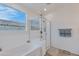 Bathroom boasts a soaking tub and walk-in shower at 17403 W Eagle Ct, Goodyear, AZ 85338