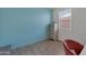 Charming bedroom with light blue walls and a comfy chair at 17403 W Eagle Ct, Goodyear, AZ 85338