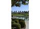 Landscaped community lake with walking path and lush greenery at 17403 W Eagle Ct, Goodyear, AZ 85338